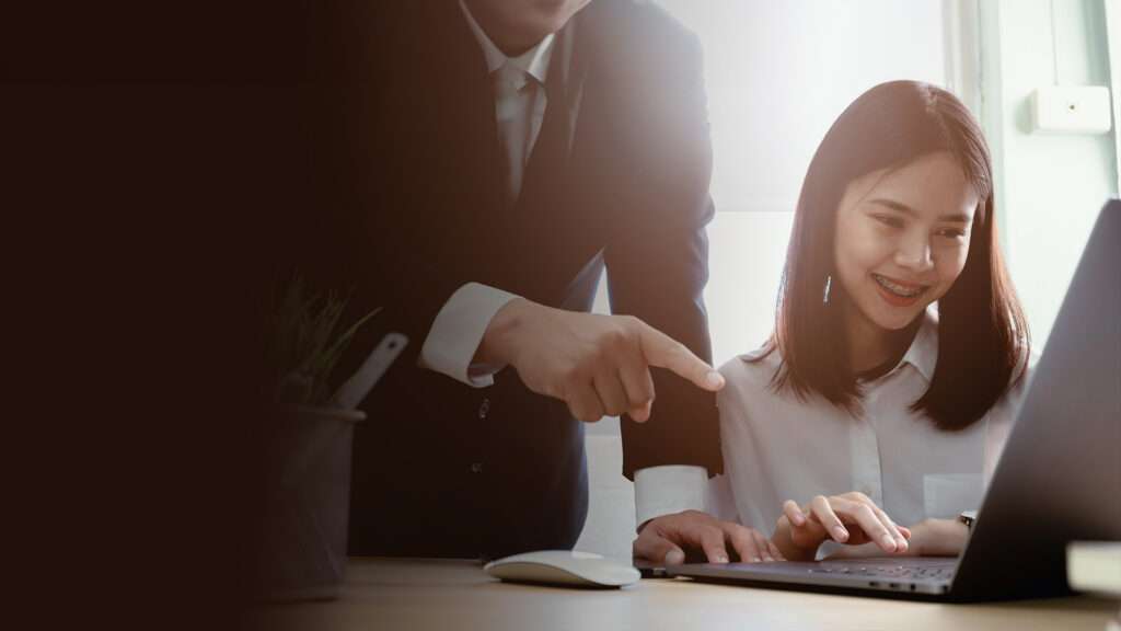 business colleagues using laptop office